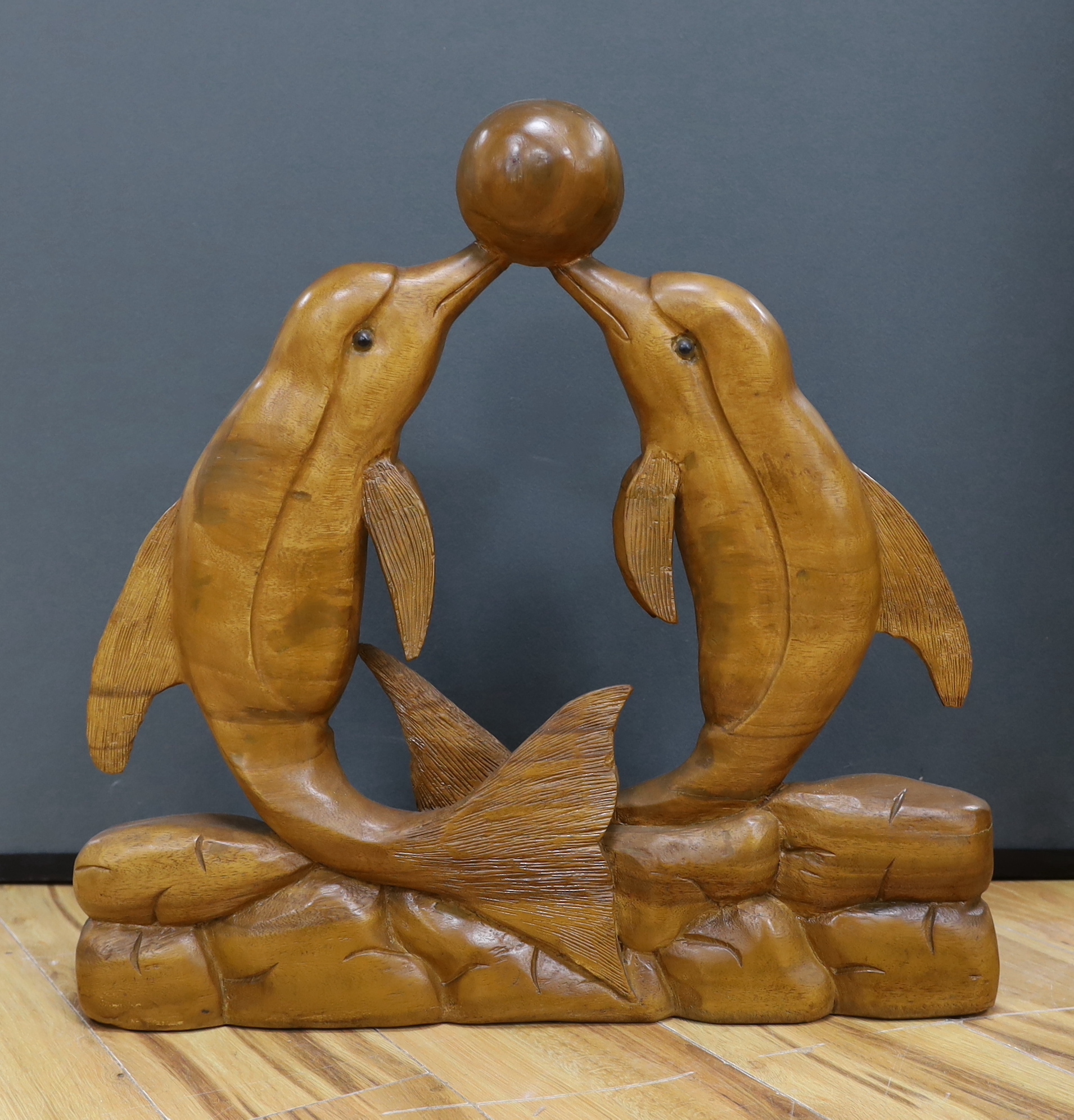 A carved dolphin group from Dolphin Square Baths, London, c.1930, 59cm
